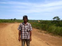 Destroyed community land and refugee farmer